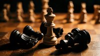 Wooden chess king stands victorious surrounded by fallen black pieces on a board, symbolizing strategy, leadership, and success.