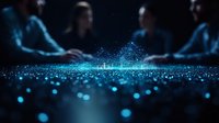Glowing blue particles scatter across dark surface with blurred business meeting in background, creating magical atmosphere for corporate presentations.