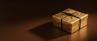 Elegant golden gift box with black ribbon bow on dark surface creating dramatic shadows for luxury holiday and celebration occasions.