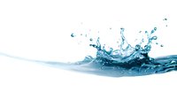 Dynamic water splash with crystal clear droplets creating a flowing wave formation against white background, isolated liquid motion photography for beverage advertising.