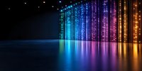 Glowing rainbow light curtain with reflection on dark surface creates futuristic atmosphere. Colorful streaming lights cast vibrant reflections in modern space.