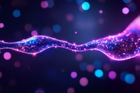 Glowing wave of sparkling particles with purple and blue bokeh lights on dark background creates magical atmosphere for festive designs and celebrations.