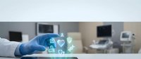 Young healthcare professional wearing blue medical gloves holding digital health icons including heart, people, and medical symbols in modern clinic environment.