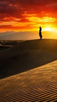 Silhouetted male runner jogging on sand dunes at golden sunset with dramatic orange sky and distant mountains, conveying determination and outdoor fitness motivation.