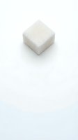 White sugar cube isolated on white background, ready for design use in food and beverage marketing materials.