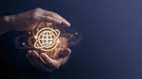 Businessman hands protecting glowing global network icon with connected dots on dark blue background representing worldwide connectivity and digital protection.