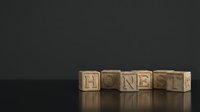 Wooden blocks spelling HONEST on a dark reflective surface, conveying integrity and trust concepts for business and motivational designs.