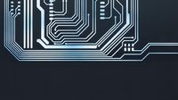 White circuit board pattern on dark background with electronic pathways and connections for technology and digital design projects.