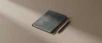 Modern gray textured notebook with matching pen on neutral beige surface with soft shadow lighting for professional workspace and stationery design.