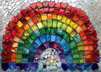Vibrant rainbow mosaic artwork featuring colorful glass tiles arranged in an arc pattern with red, orange, yellow, green, blue and purple segments creating a striking decorative piece.