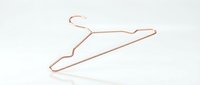 Copper wire clothes hanger on white background, isolated minimalist wardrobe accessory for fashion, retail, and home organization concepts.