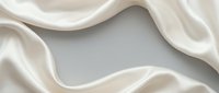 Luxurious cream silk fabric with flowing curves and soft shadows creating elegant waves on neutral background for premium textile design projects.