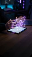 Hands hovering over tablet with glowing purple holographic heart projection in futuristic office environment for healthcare technology concepts.