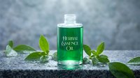 Green herbal essence oil bottle with fresh mint leaves on stone surface for natural skincare and aromatherapy wellness treatments.