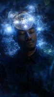 Young African American man with closed eyes surrounded by mystical blue cosmic energy and glowing geometric patterns, representing spiritual awakening and consciousness.