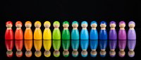 Colorful wooden peg people figures arranged in rainbow spectrum from red to pink on black background with reflections for diversity concepts.