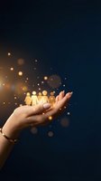 Human hand holding glowing golden people figures with magical light effects representing teamwork, community support and human resources management.