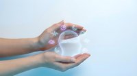 Hands protecting glowing digital health icons including heart rate, medical cross and wellness symbols on clean background for healthcare technology concepts.