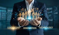 Business professional holding glowing human figures representing team leadership and innovation in digital technology environment for corporate presentations.