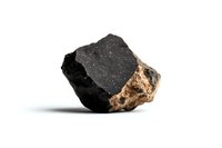 Raw black coal chunk with brown mineral deposits on white background, showing natural texture and geological formation detail. Isolated mineral specimen for energy industry.