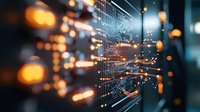 Glowing orange light trails and bokeh effects merge with digital circuit patterns creating futuristic technology visualization background for data connectivity concepts.