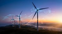 Wind turbines generating renewable energy at sunset with digital technology overlay and data visualization elements for sustainable power concepts.