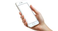 Female hand holding modern smartphone with blank white screen isolated on white background, mockup for app or web design presentation.