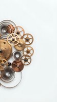 Vintage clockwork gears and springs arrangement on white background. Steampunk mechanical parts composition for industrial design projects.
