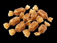 Assorted caramel and toffee candies wrapped in golden foil, isolated on transparent background. Ready for design use on packaging, posters, clipart, and print-on-demand products.