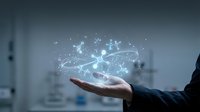 Businessman hand holding glowing network connections with digital particles and light effects in modern office environment for technology presentations.