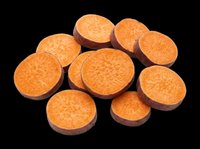 Sliced sweet potato rounds isolated on transparent background, ready for culinary designs, recipe graphics, food packaging, print-on-demand products, and kitchen-themed digital projects.