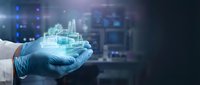 Scientist in blue gloves holding holographic industrial factory with gears and smokestacks. Digital technology concept for manufacturing innovation and smart industry.