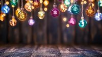 Colorful glowing light bulbs hanging over rustic wooden table with bokeh effect background creates magical festive atmosphere for holiday celebrations.