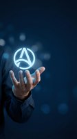 Businessman holding glowing navigation arrow icon above open palm against dark blue background with bokeh lights, representing GPS technology, direction guidance, and digital navigation solutions.
