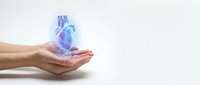 Human hands cupping glowing anatomical heart with medical hologram effect on white background for healthcare and cardiology concepts.