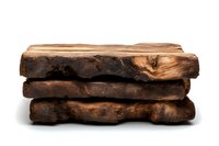 Stack of aged dark wooden planks with natural rough edges and rustic texture showing authentic wood grain patterns on white background, isolated.
