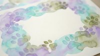 Watercolor floral wreath with purple and green leaves on white paper background, hand painted botanical border frame for wedding invitations and greeting cards.