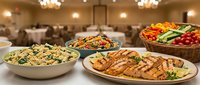 Elegant catering buffet spread with grilled meat, pasta salad and fresh vegetables in upscale banquet hall for corporate events and celebrations.