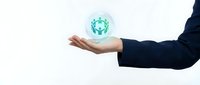 Businessman hand presenting glowing green digital virus or bacteria symbol floating above palm on white background for medical technology concepts.