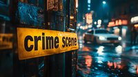 Yellow crime scene tape in dark rainy urban setting with blurred police lights and wet street reflections creating moody atmospheric night scene for crime stories.
