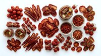 Assorted red dates jujube fruits dried snacks traditional Chinese medicine ingredients healthy organic food flat lay arrangement on white background.