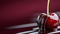 Fresh ripe red cherry with dark chocolate sauce dripping down on burgundy background with selective focus and copy space for food design.