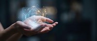 Hands holding glowing digital brain with neural network connections and light particles, representing artificial intelligence and innovation technology.