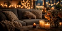 Cozy living room interior with warm candles and autumn flowers creating intimate atmosphere for home decor and relaxation concepts.