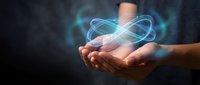 Human hands holding glowing blue energy orb with light trails against dark background for technology and innovation concepts.
