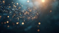 Glowing golden lights and delicate tree branches against dark teal background create magical atmosphere with bokeh effect and soft focus for festive designs.