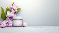 Pink cosmetic cream jar with fresh orchid flowers on marble surface against light gray background, elegant spa and beauty concept for skincare products.