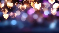 Glowing heart shaped lights creating romantic bokeh effect against dark background with purple and blue tones, perfect for Valentine's Day or wedding designs.