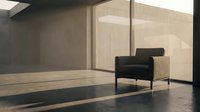 Modern minimalist interior with black armchair and wooden accent, featuring polished concrete flooring and floor-to-ceiling windows for contemporary home and office design projects.