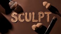 Sculpting tools and brushes arranged around embossed gold lettering on brown background, representing art, craftsmanship, and creative design work.